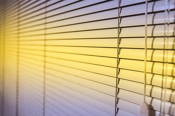 A professional working on blinds.
