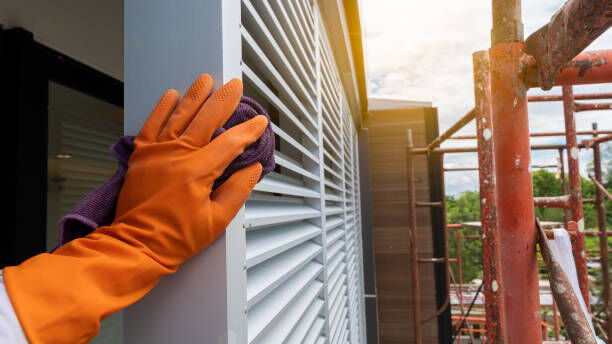 A professional working on blinds.